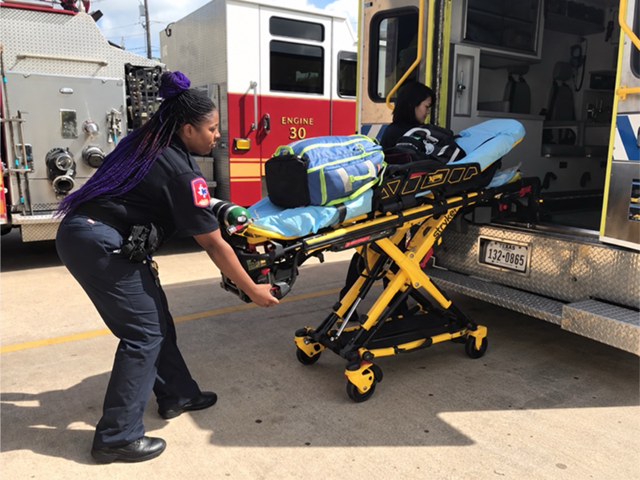 Medics unloading a stretcher