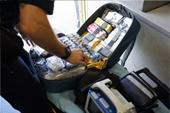 Medic organizing a jump bag