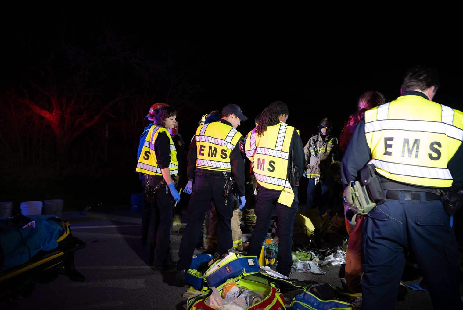 Medic restocking the back of an ambulance
